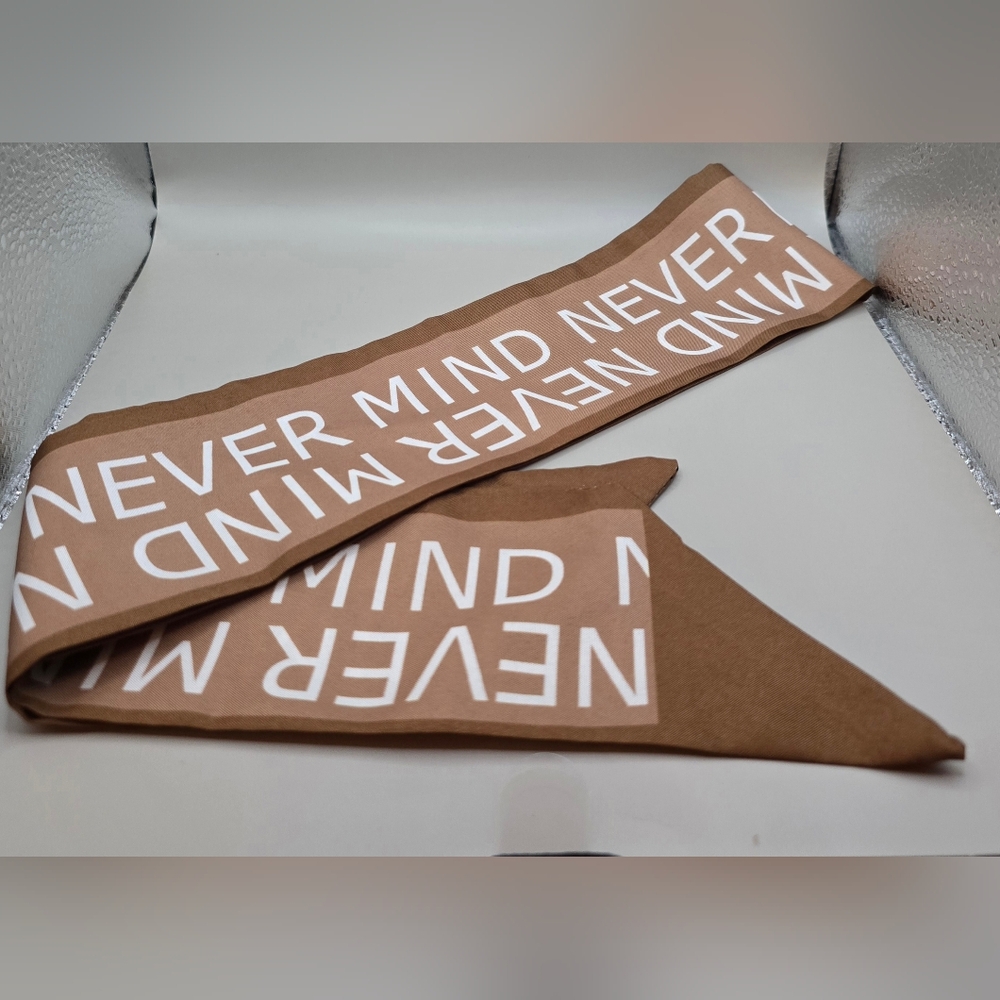 Handle Wrap/Twillie For Your Bag Handle Reads 'Never Mind'